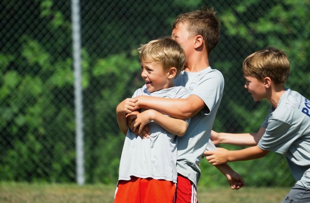 Campers celebrating together on the field