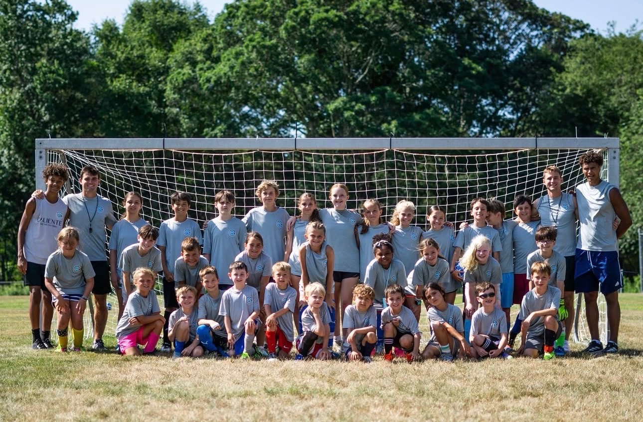 Full camp group photo in front of the goal