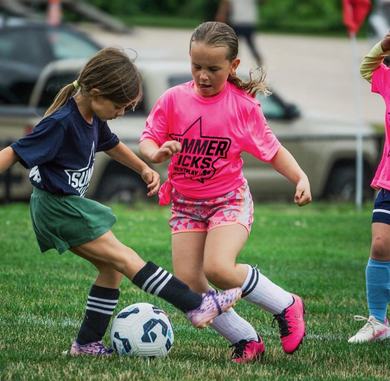 Summer Kicks girls battling for the ball